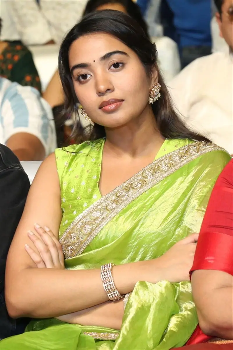 Shivathmika Rajashekar in Green Saree Sleeveless Blouse